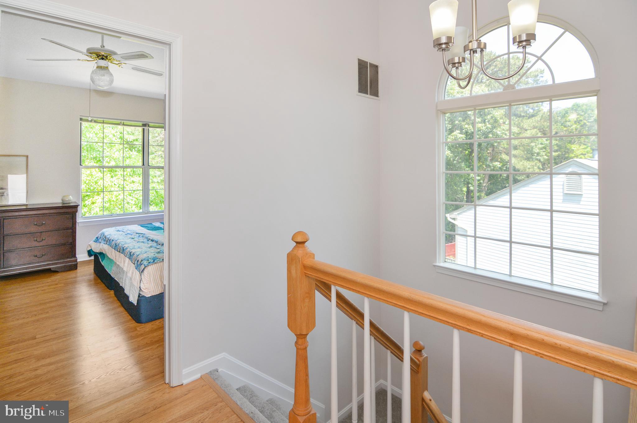 2186 Commissary Circle Odenton, MD 21113 - Photo 21 of 35 Vaulted Ceilings and large window in stairwell