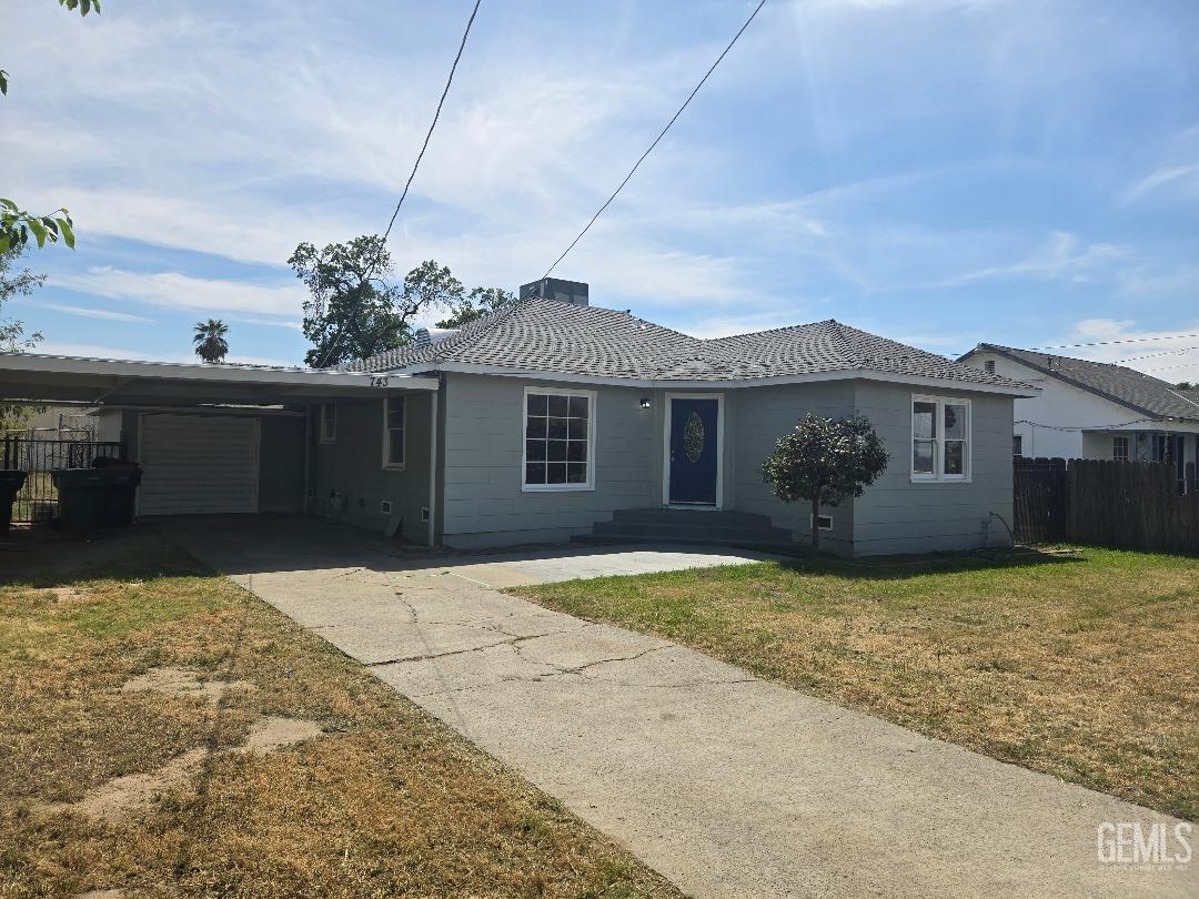 Restricted Address Tulare, CA 93274 - Photo 1 of 1 a front view of a house with a yard and garage