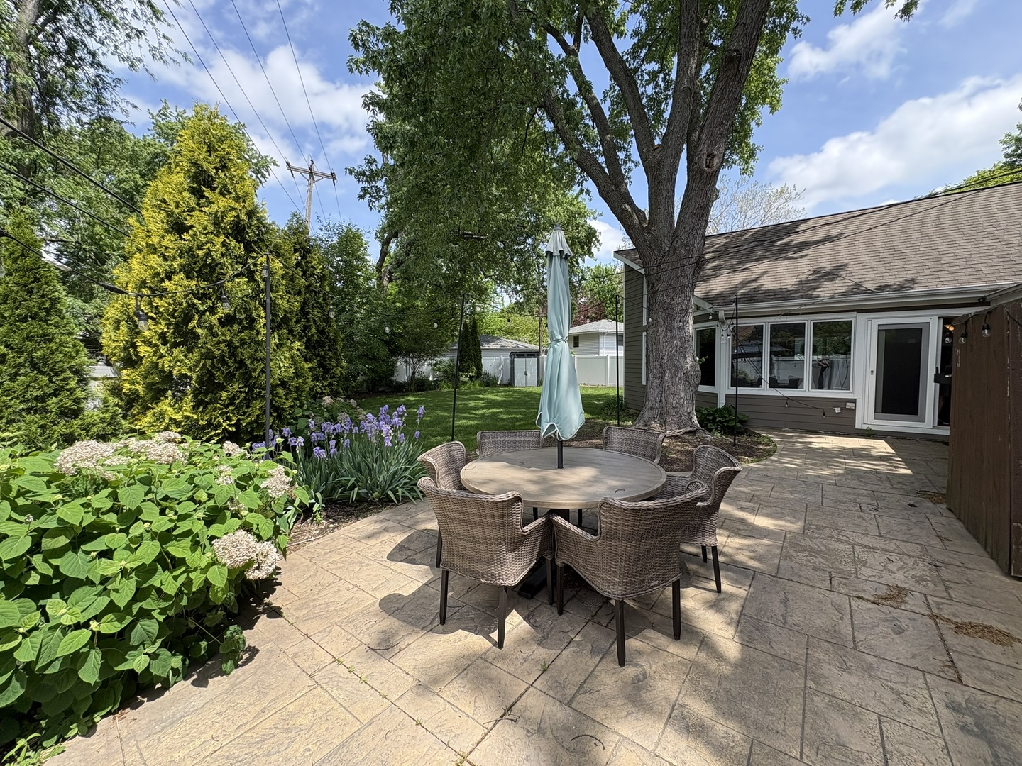 609 West Gartner Road Naperville, IL 60540 - Photo 21 of 23 a view of a house with backyard and sitting area
