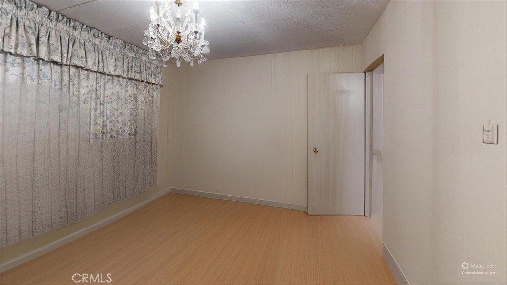 14851 Jeffrey Road, Unit 117 Irvine, CA 92618 - Photo 44 of 45 a view of a chandelier in an empty room