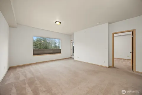 a living room with furniture a chandelier and a dining room