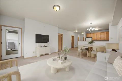 a kitchen with white cabinets and white appliances