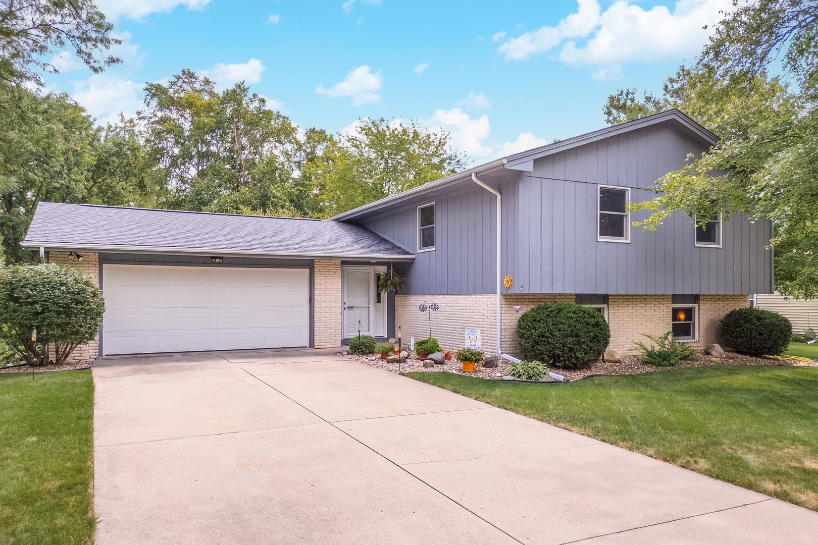314 North Bone Drive Normal, IL 61761 - Photo 1 of 45 a front view of a house with a garden and yard
