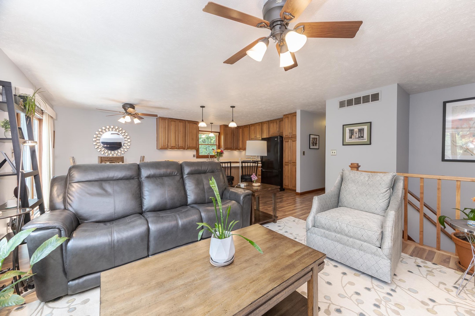 314 North Bone Drive Normal, IL 61761 - Photo 16 of 45 a living room with furniture kitchen view and a chandelier