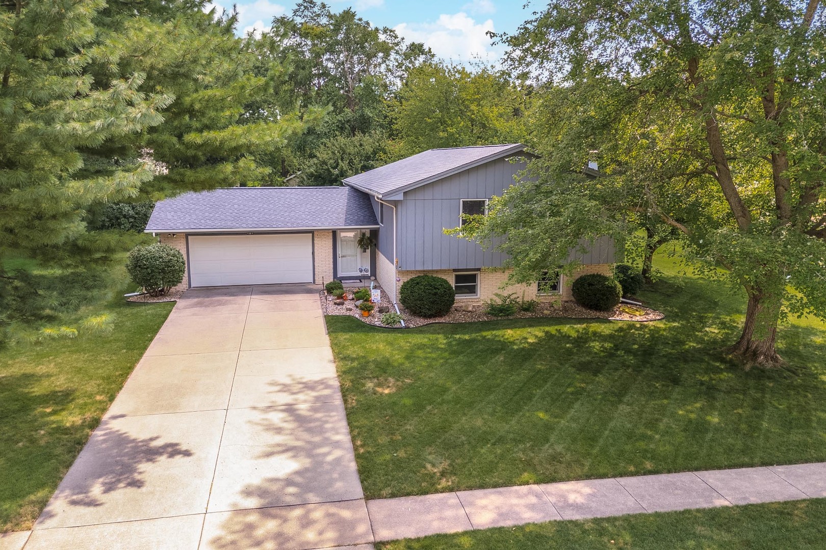 314 North Bone Drive Normal, IL 61761 - Photo 2 of 45 a front view of a house with garden