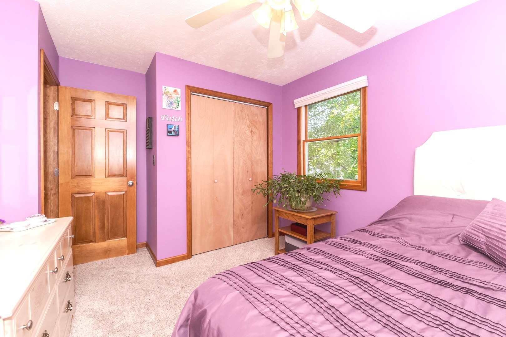 314 North Bone Drive Normal, IL 61761 - Photo 23 of 45 a bedroom with a bed and a chandelier