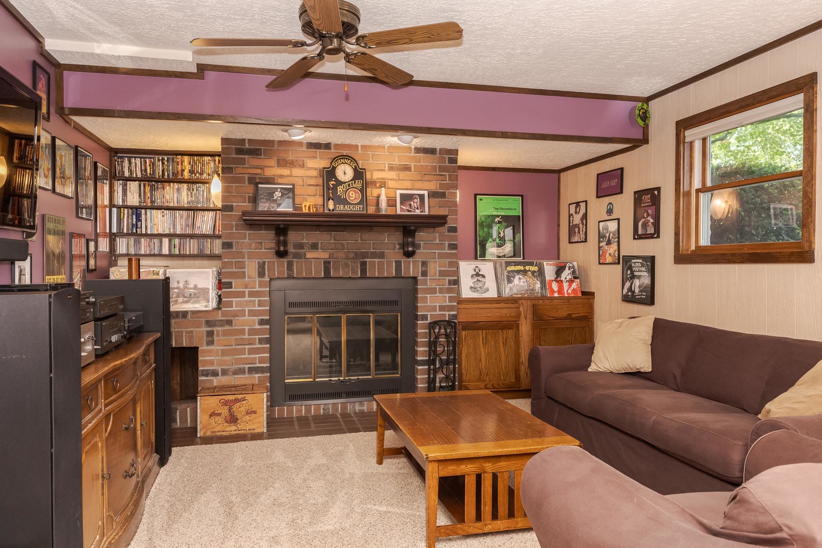 314 North Bone Drive Normal, IL 61761 - Photo 28 of 45 a living room with furniture a flat screen tv and a fireplace