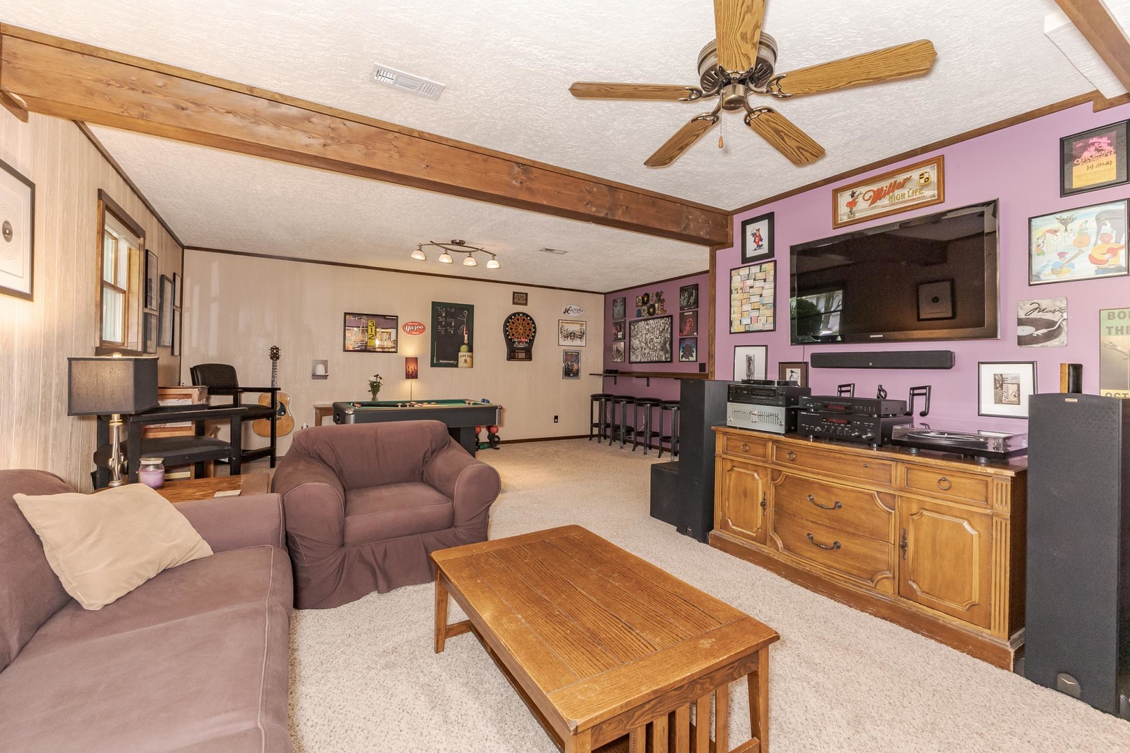 314 North Bone Drive Normal, IL 61761 - Photo 30 of 45 a living room with furniture a flat screen tv and kitchen view