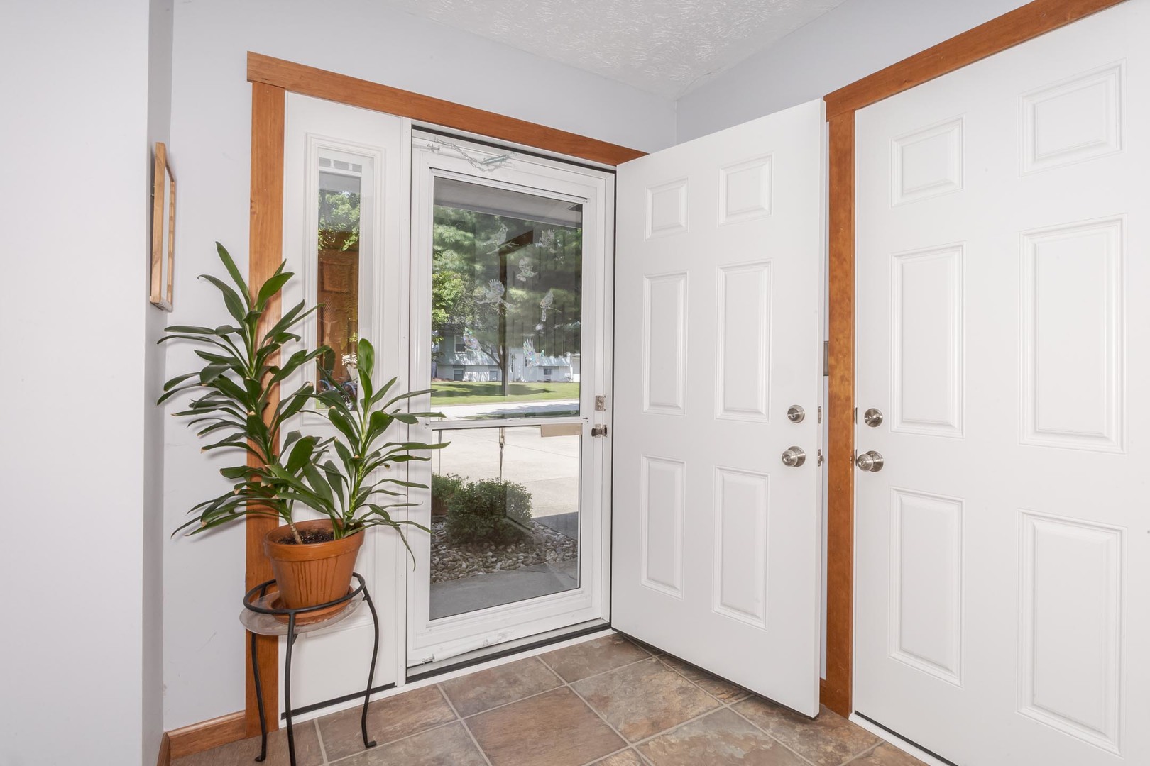 314 North Bone Drive Normal, IL 61761 - Photo 4 of 45 a glass door with a plant and a plant in it