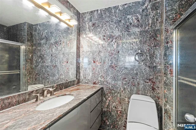 a view of room with window and wooden floor