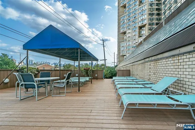 a view of a lake with tall buildings