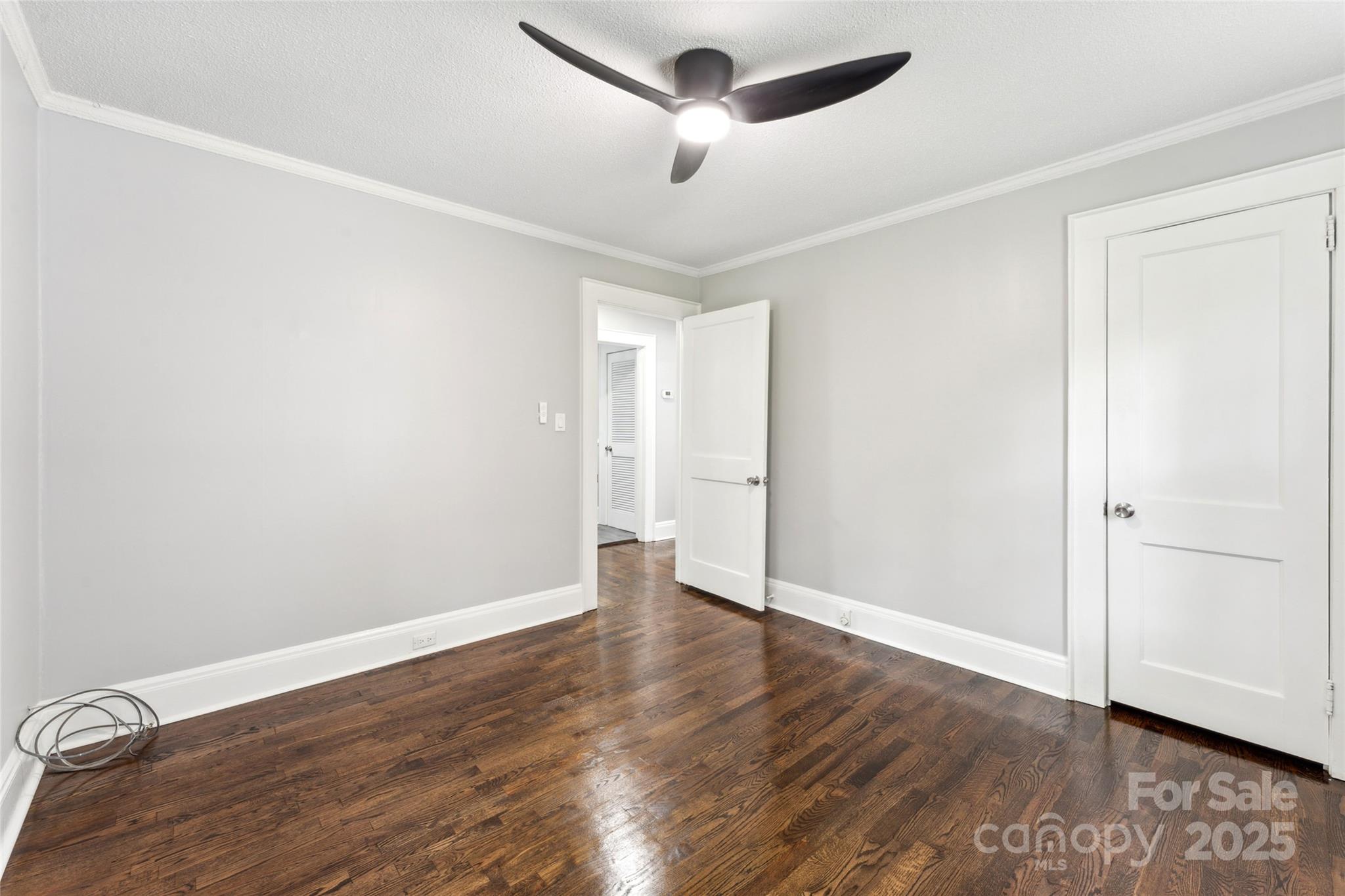 514 West 8th Avenue Gastonia, NC 28052 - Photo 17 of 19 a view of an empty room with wooden floor