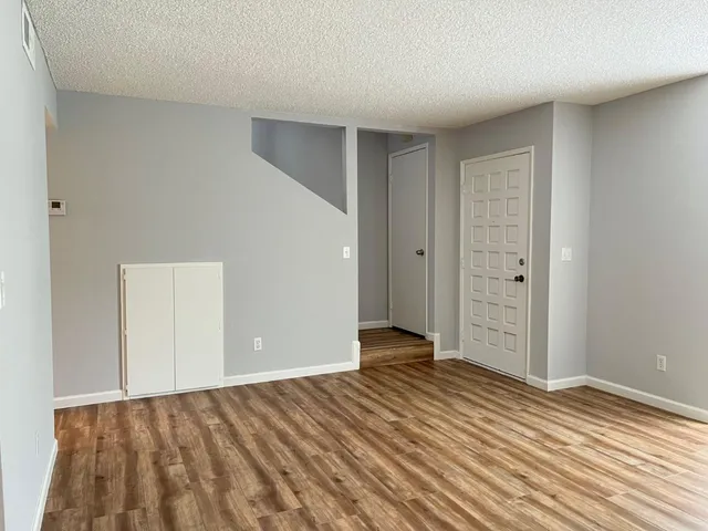 wooden floor and closet in a room