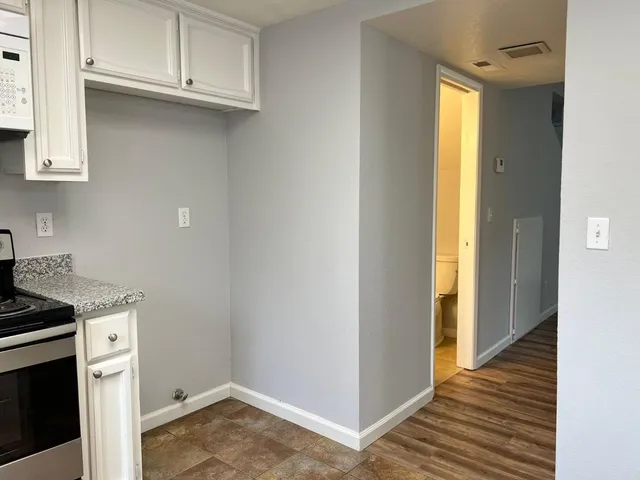 a view of a storage and utility room with cabinets