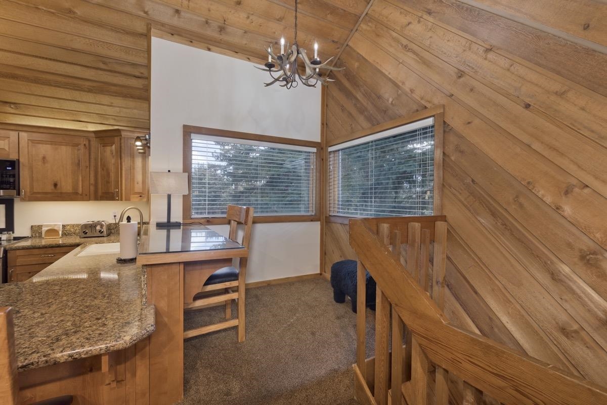 61 Goldhill, Unit 61 Mammoth Lakes, CA 93546 - Photo 16 of 44 a room with chandelier fan and windows