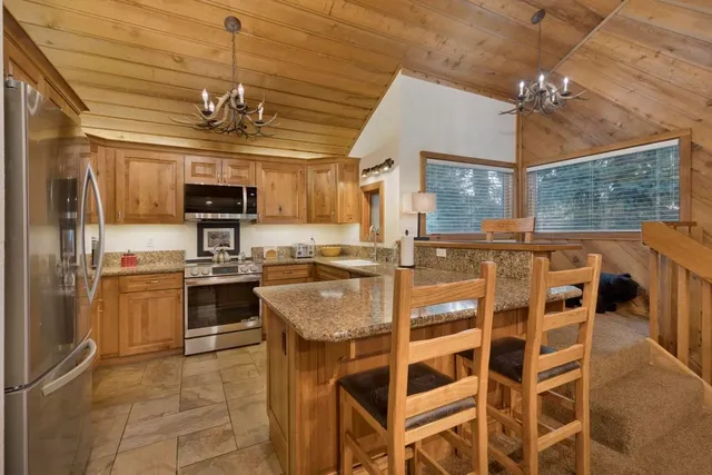 a kitchen with a counter space cabinets and stainless steel appliances