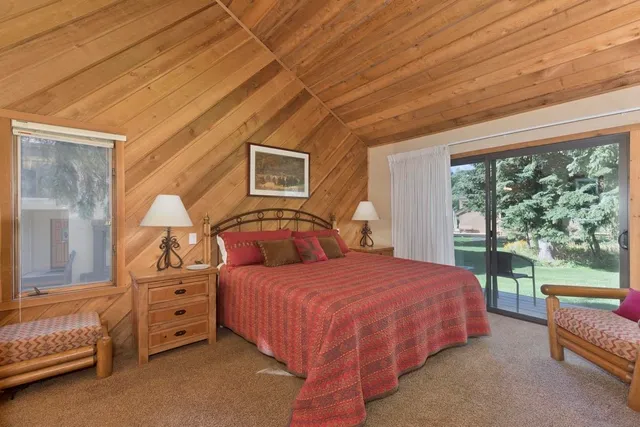 a bedroom with a bed and a view of bedroom