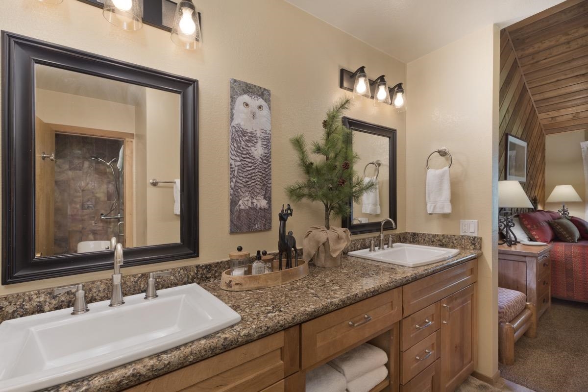 61 Goldhill, Unit 61 Mammoth Lakes, CA 93546 - Photo 25 of 44 a bathroom with double vanity sinks and a mirror
