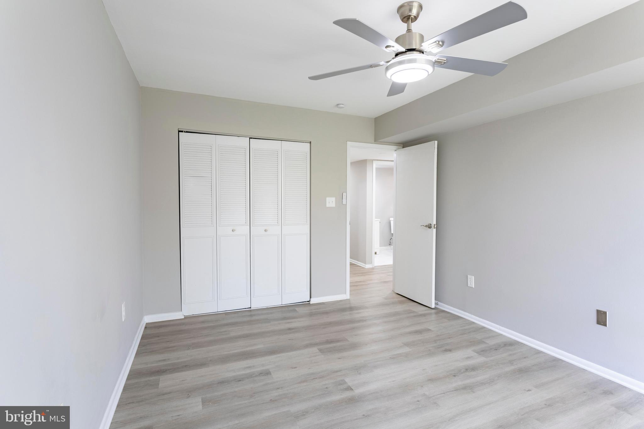 8467 Greenbelt Road, Unit 8467102 Greenbelt, MD 20770 - Photo 21 of 30 wooden floor in an empty room