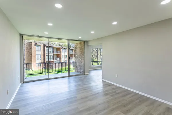 a view of room with wooden floor