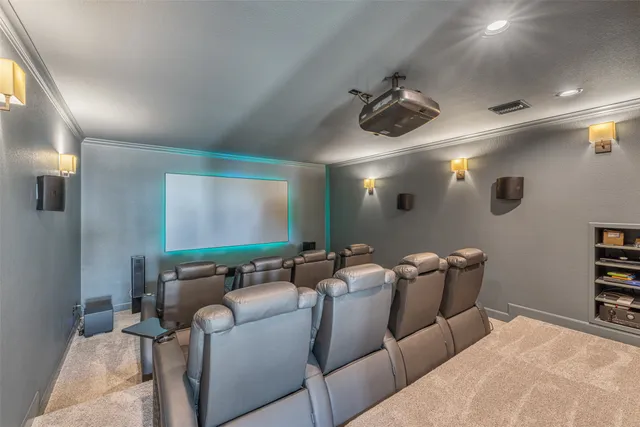 a media room with lots of chairs and a projector screen