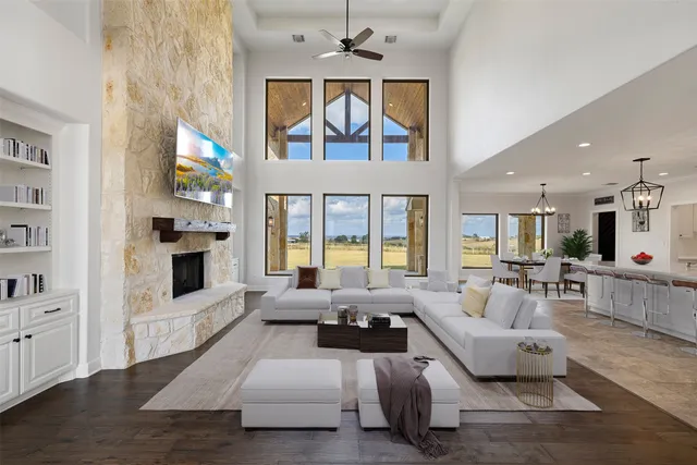 a living room with furniture fireplace and flat screen tv