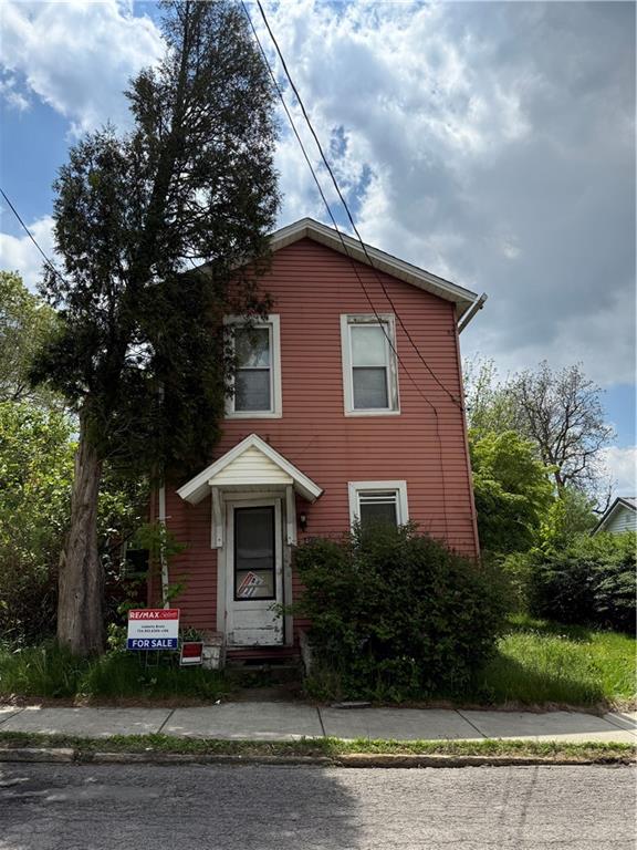 482 Hull Street Sharon, PA 16146 - Photo 1 of 2 a front view of a house with a garden