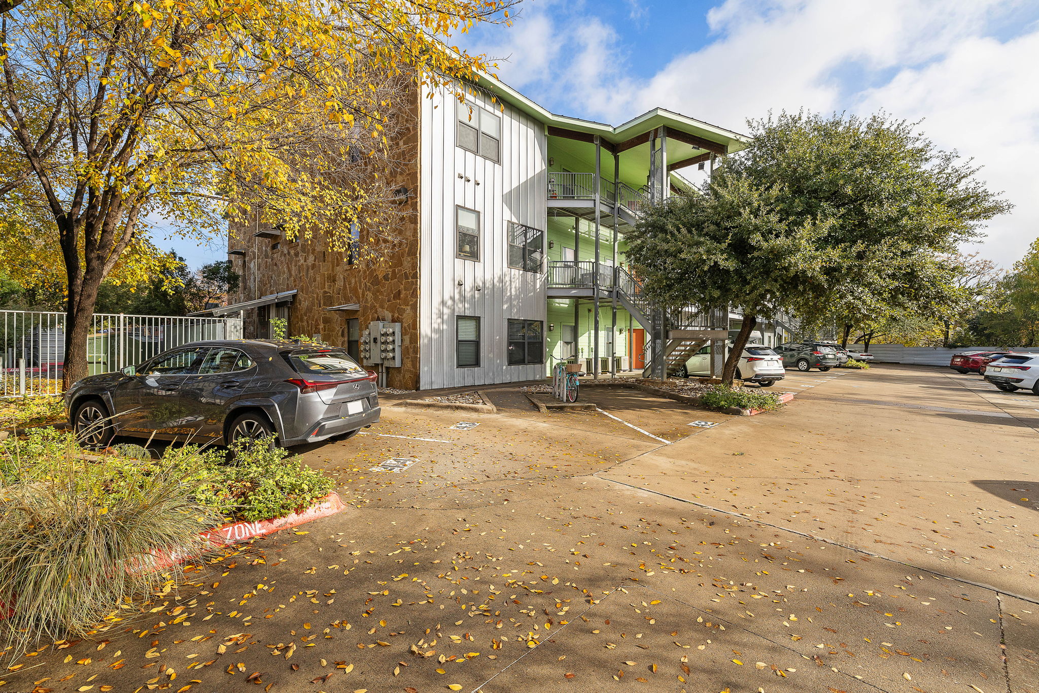 1807 Poquito Street, Unit 41 Austin, TX 78702 - Photo 1 of 23 View of property with uncovered parking and stairway