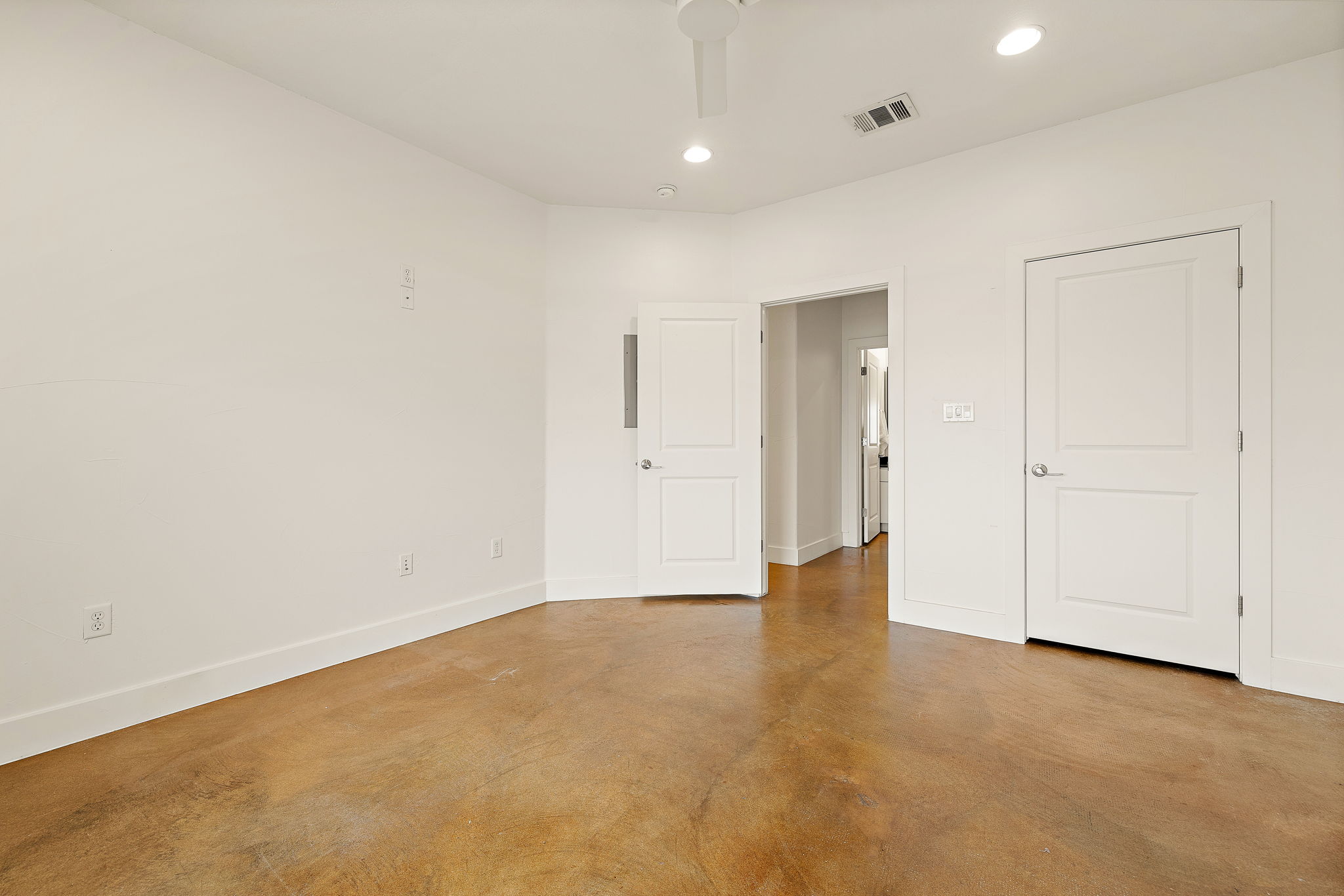 1807 Poquito Street, Unit 41 Austin, TX 78702 - Photo 20 of 23 Unfurnished bedroom featuring concrete floors, recessed lighting, and a ceiling fan