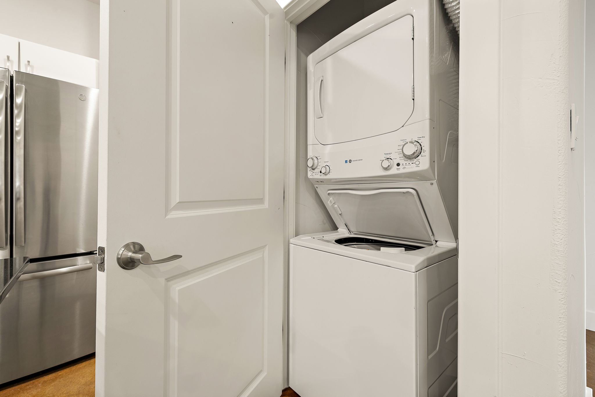 1807 Poquito Street, Unit 41 Austin, TX 78702 - Photo 22 of 23 Washroom with estacked washer and dryer