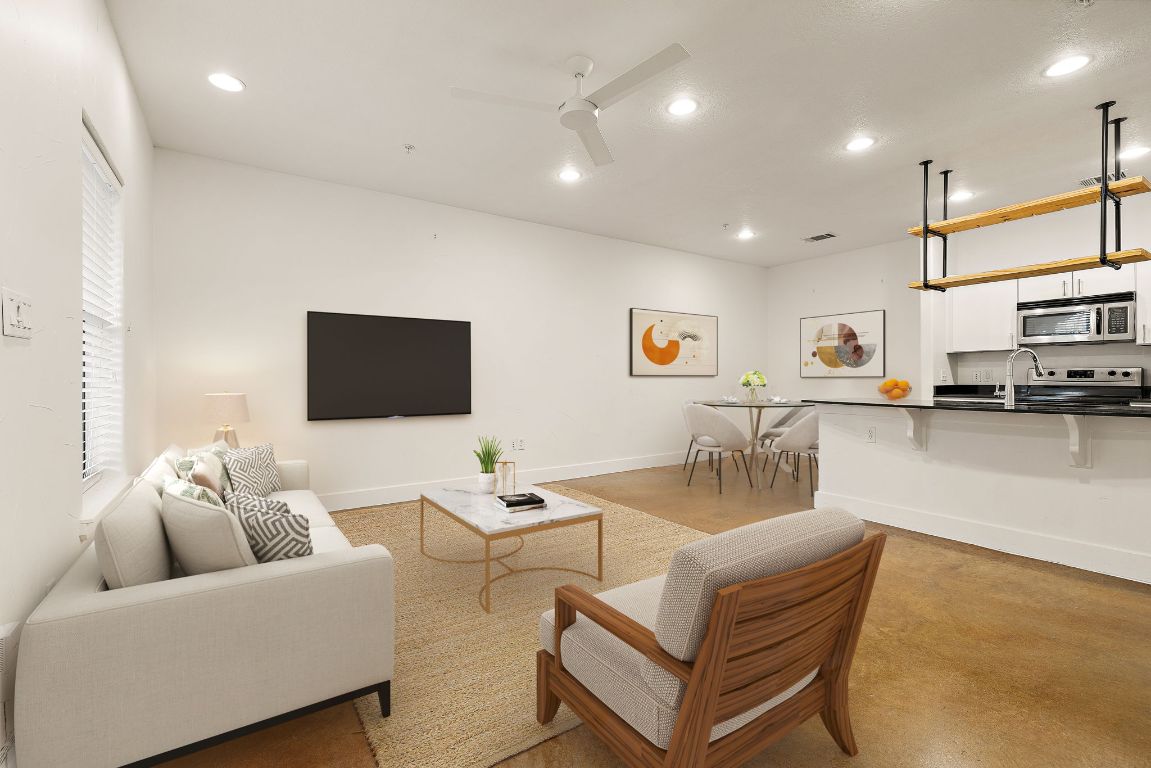 1807 Poquito Street, Unit 41 Austin, TX 78702 - Photo 4 of 23 a living room with furniture and a flat screen tv