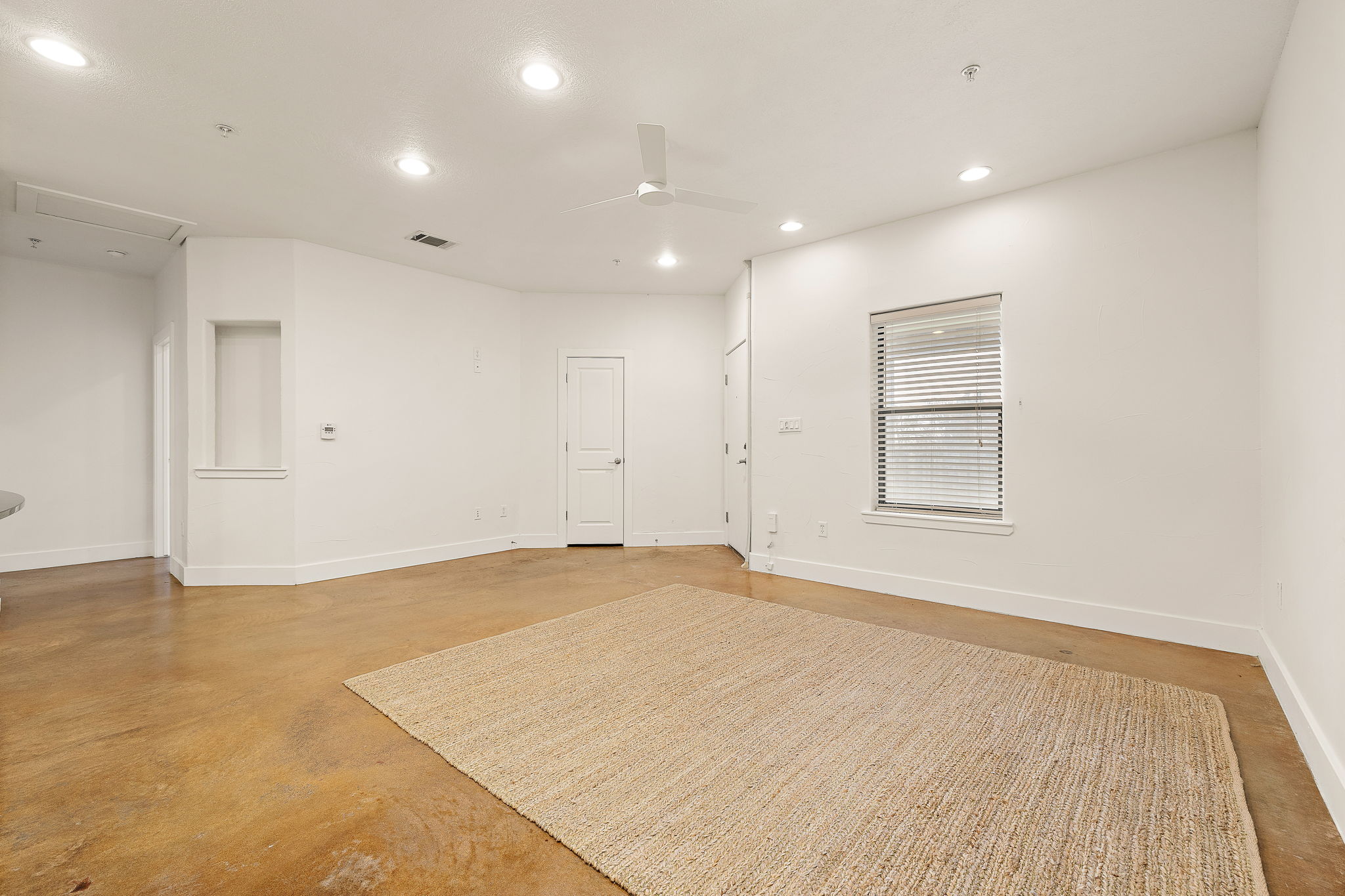 1807 Poquito Street, Unit 41 Austin, TX 78702 - Photo 5 of 23 Unfurnished room featuring recessed lighting, a ceiling fan, and concrete flooring