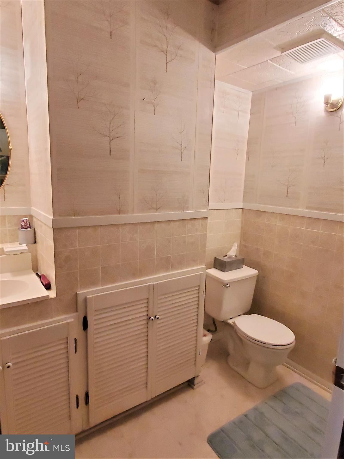 1212 Keithmont Road Catonsville, MD 21228 - Photo 23 of 33 a bathroom with a toilet and a sink