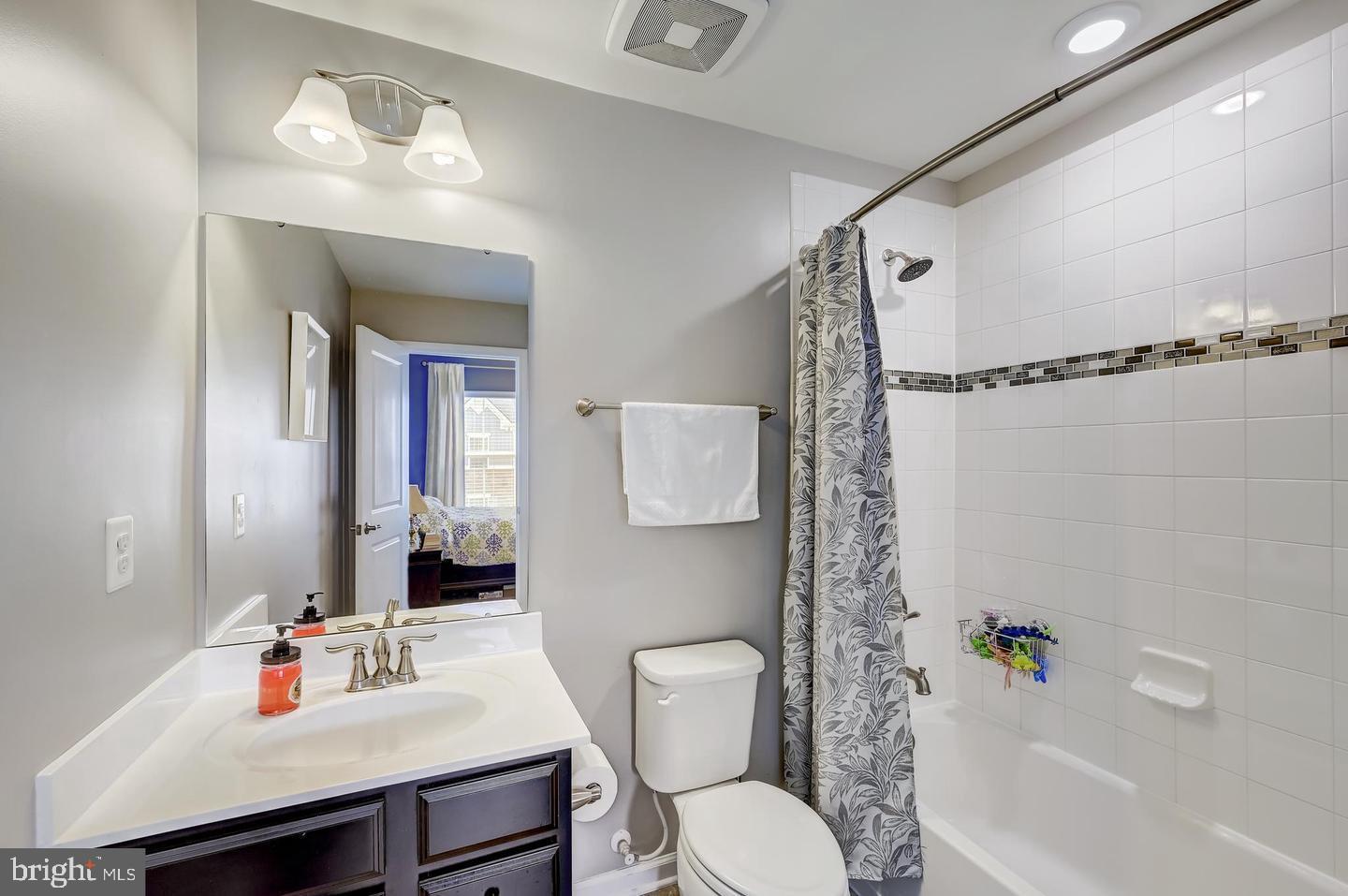 8102 Secluded Cove Lane Baltimore, MD 21222 - Photo 12 of 23 a bathroom with a sink toilet and shower