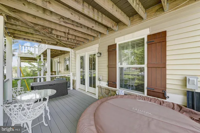 a view of balcony with couch and wooden floor