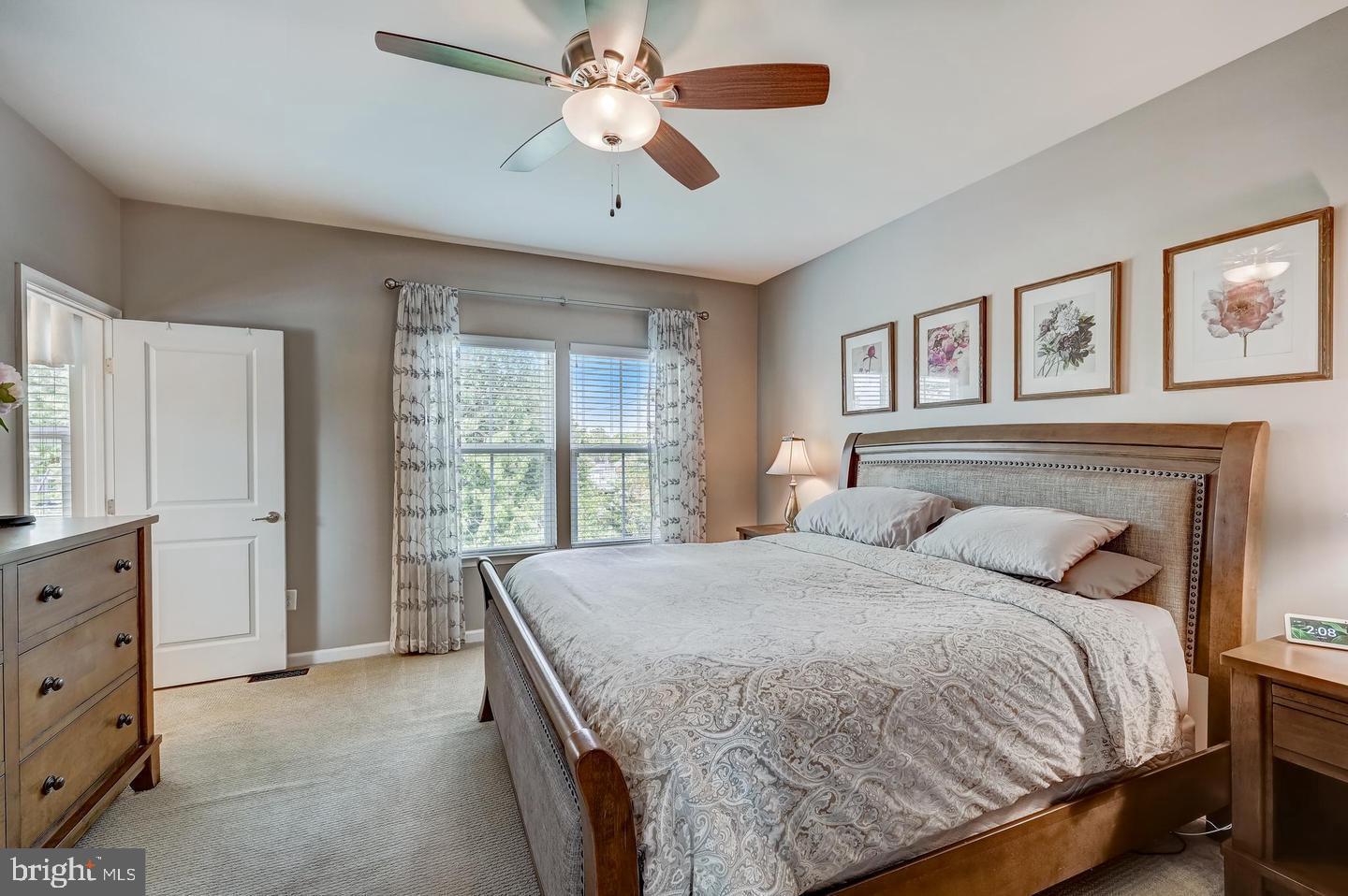 8102 Secluded Cove Lane Baltimore, MD 21222 - Photo 9 of 23 a bedroom with a large bed and a window