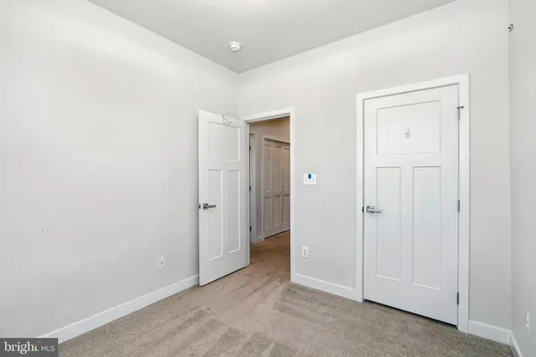 an empty room with closet area