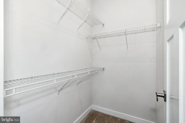 a view of a room with racks on the wall