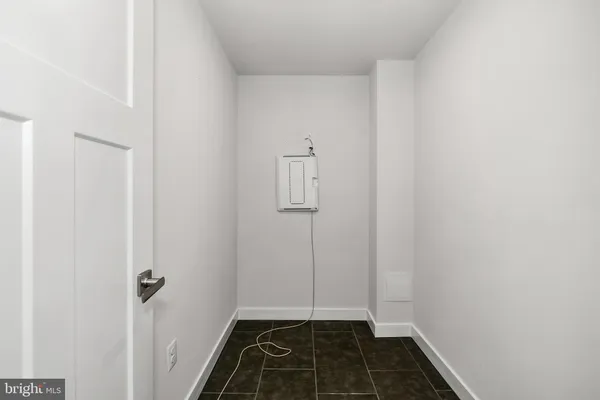 a view of a utility room with closet
