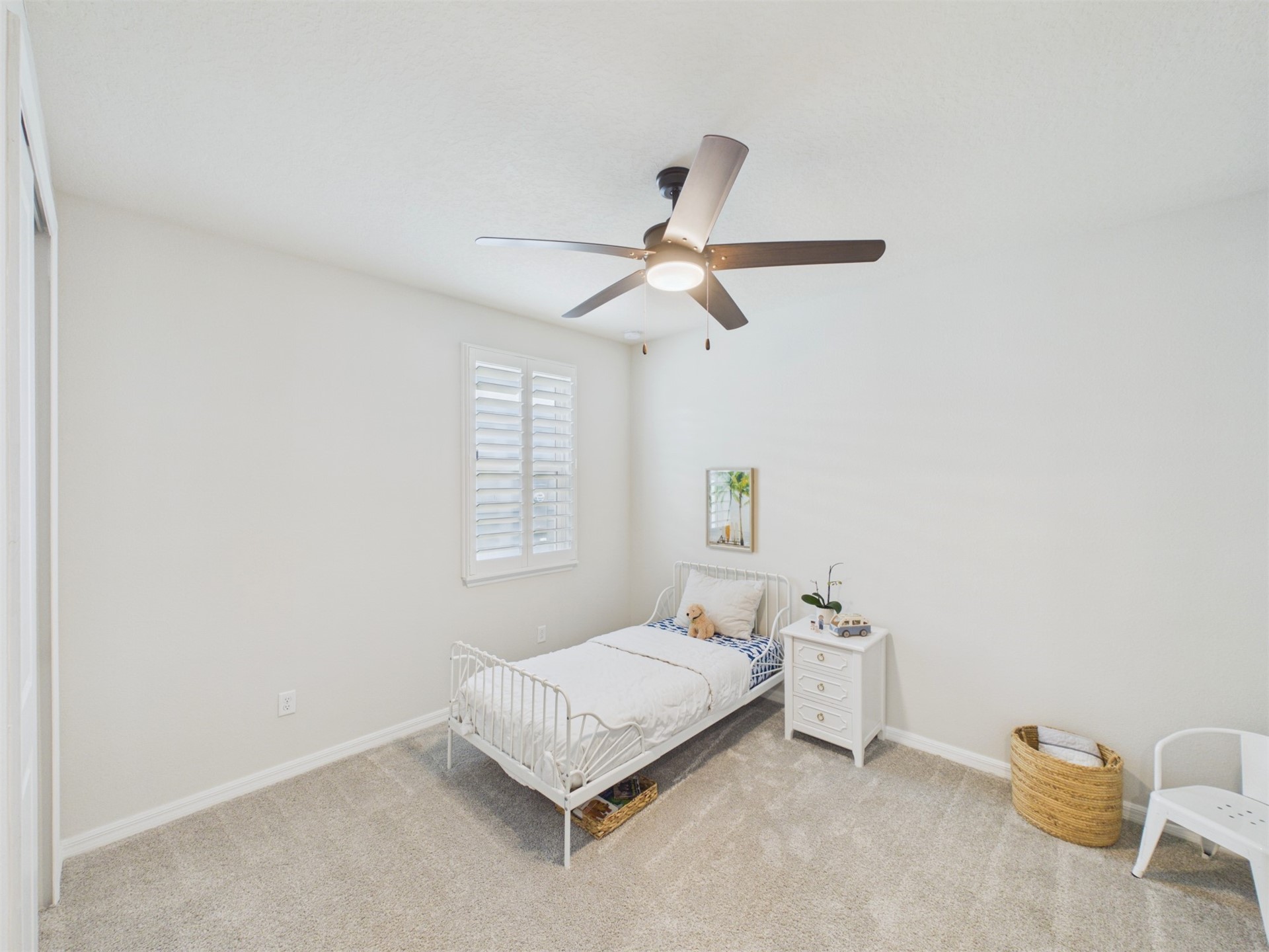 312 Salt Meadow Loop Yulee, FL 32097 - Photo 13 of 22 a bedroom with a bed and a ceiling fan