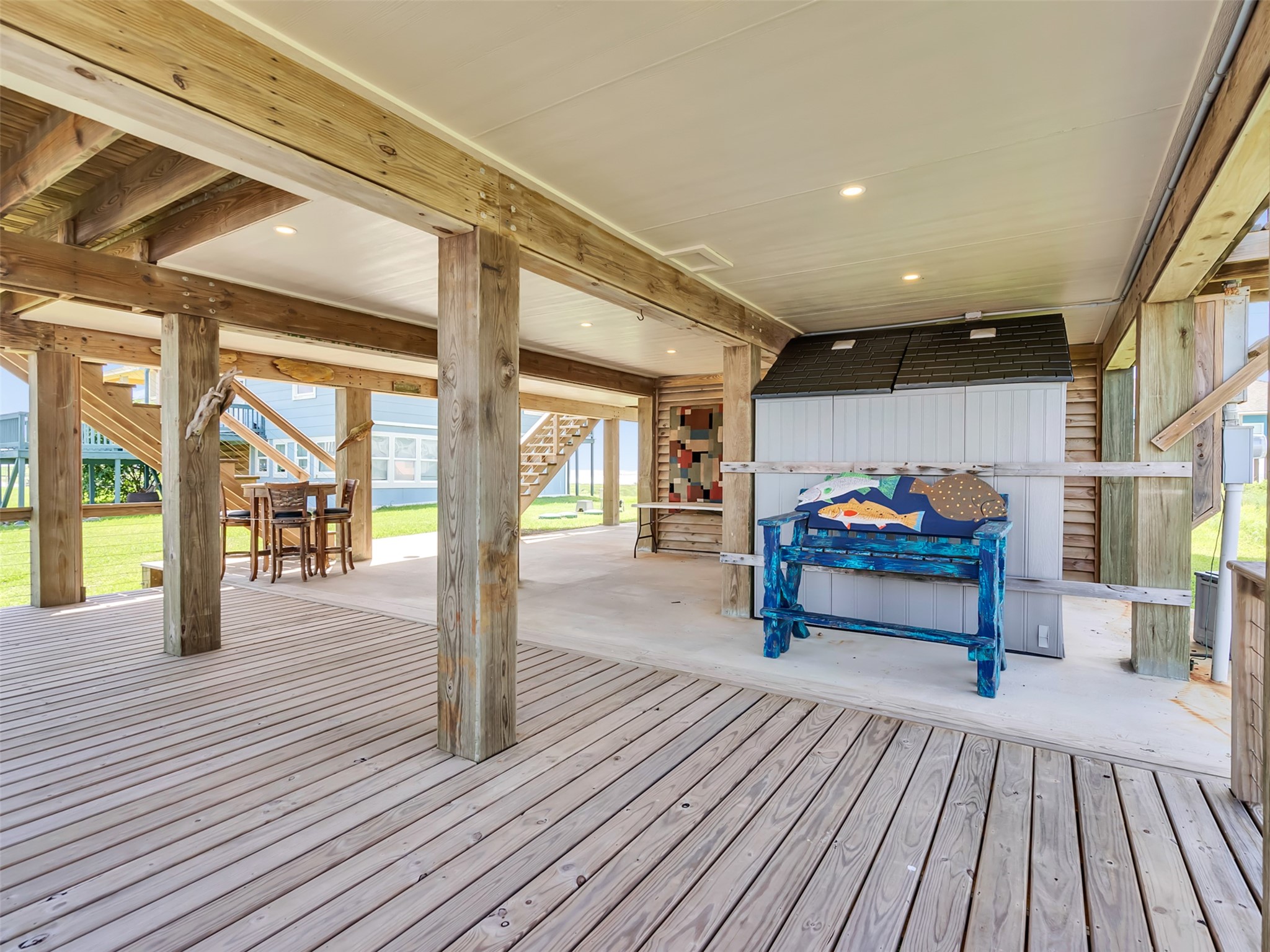 1453 County Road 230 Sargent, TX 77414 - Photo 23 of 38 Covered Outdoor Living Area — Spacious area beneath the home offering endless possibilities for entertaining, relaxing, dining, or creating your own coastal gathering space