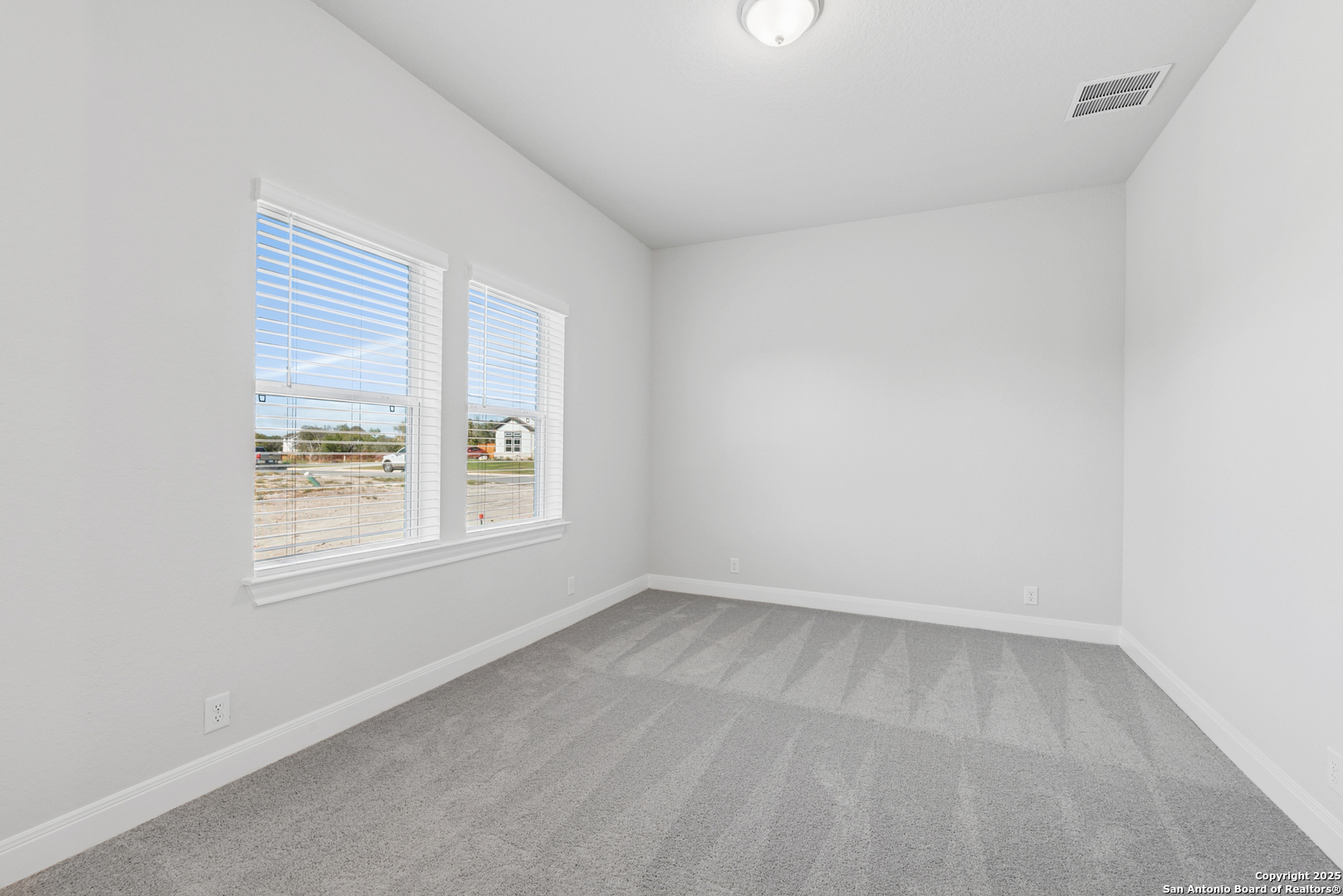 212 Brandon Cove Castroville, TX 78009 - Photo 15 of 36 an empty room with a window
