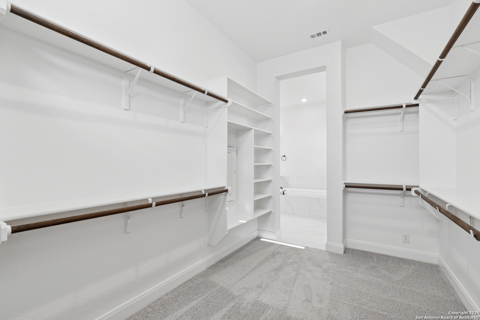 212 Brandon Cove Castroville, TX 78009 - Photo 34 of 36 a view of an empty walk in closet