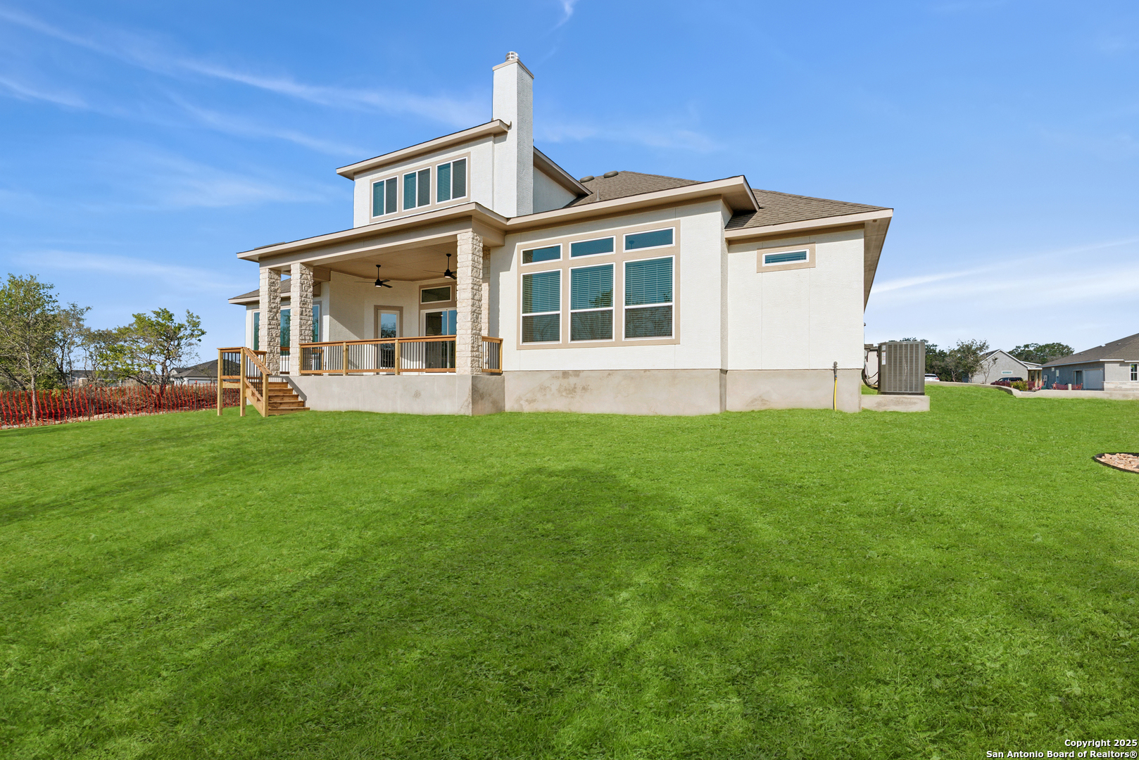 212 Brandon Cove Castroville, TX 78009 - Photo 8 of 36 a front view of a house with a yard