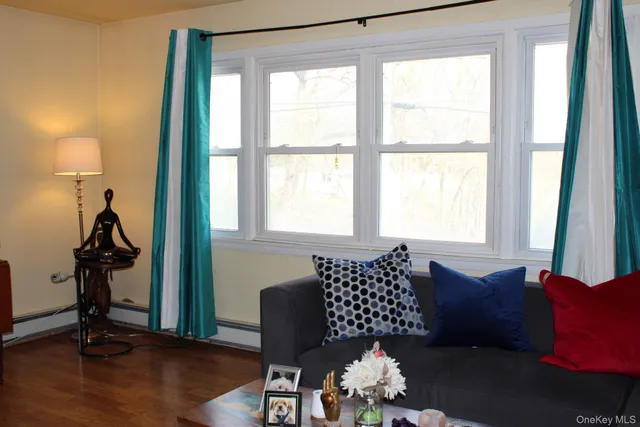 a view of workspace with wooden floor windows