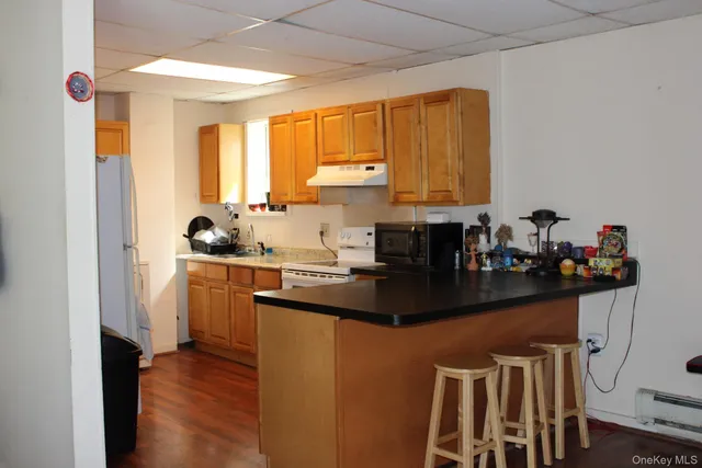 a bedroom with a bed and a potted plant