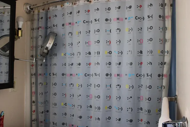 a view of a hallway to a room with windows