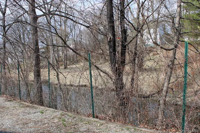 a brick house with a yard