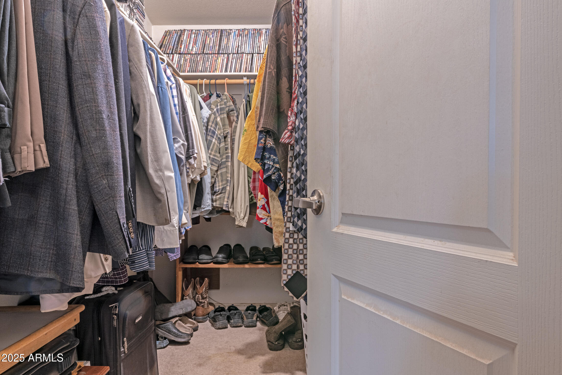 2179 Hackamore Drive Overgaard, AZ 85933 - Photo 15 of 26 a view of walk in closet with clothes