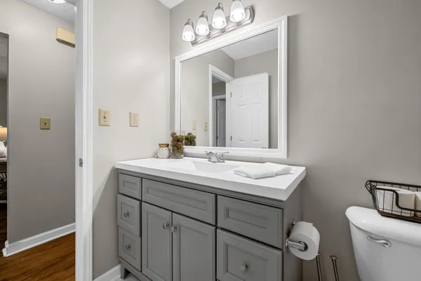 a bathroom with a sink vanity and a mirror